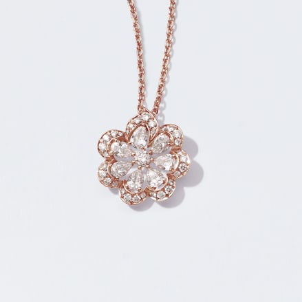 Collier in oro rosa e diamanti, orecchini e collier in oro bianco e diamanti